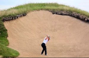 Hitting out of the sand trap with the proper stance